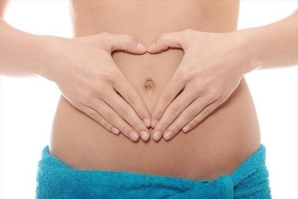 Cảm giác bụng dưới căng cứng khi mới mang thai do đâu?